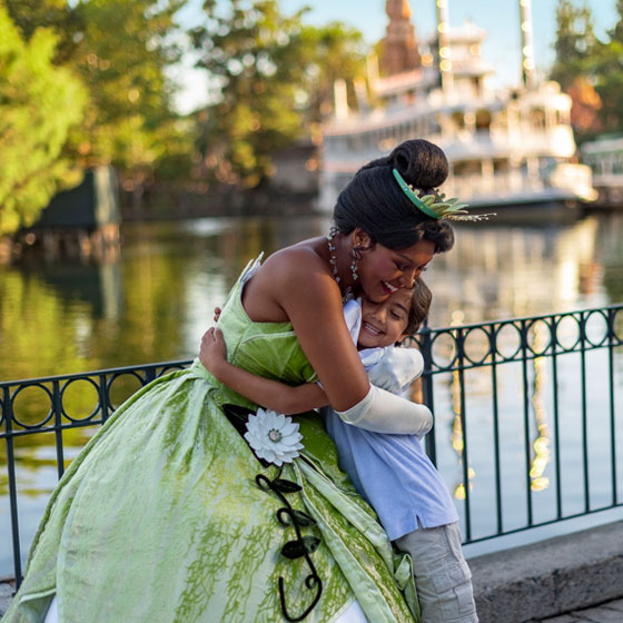 Disneyland Resort Princess Tiana hugging child