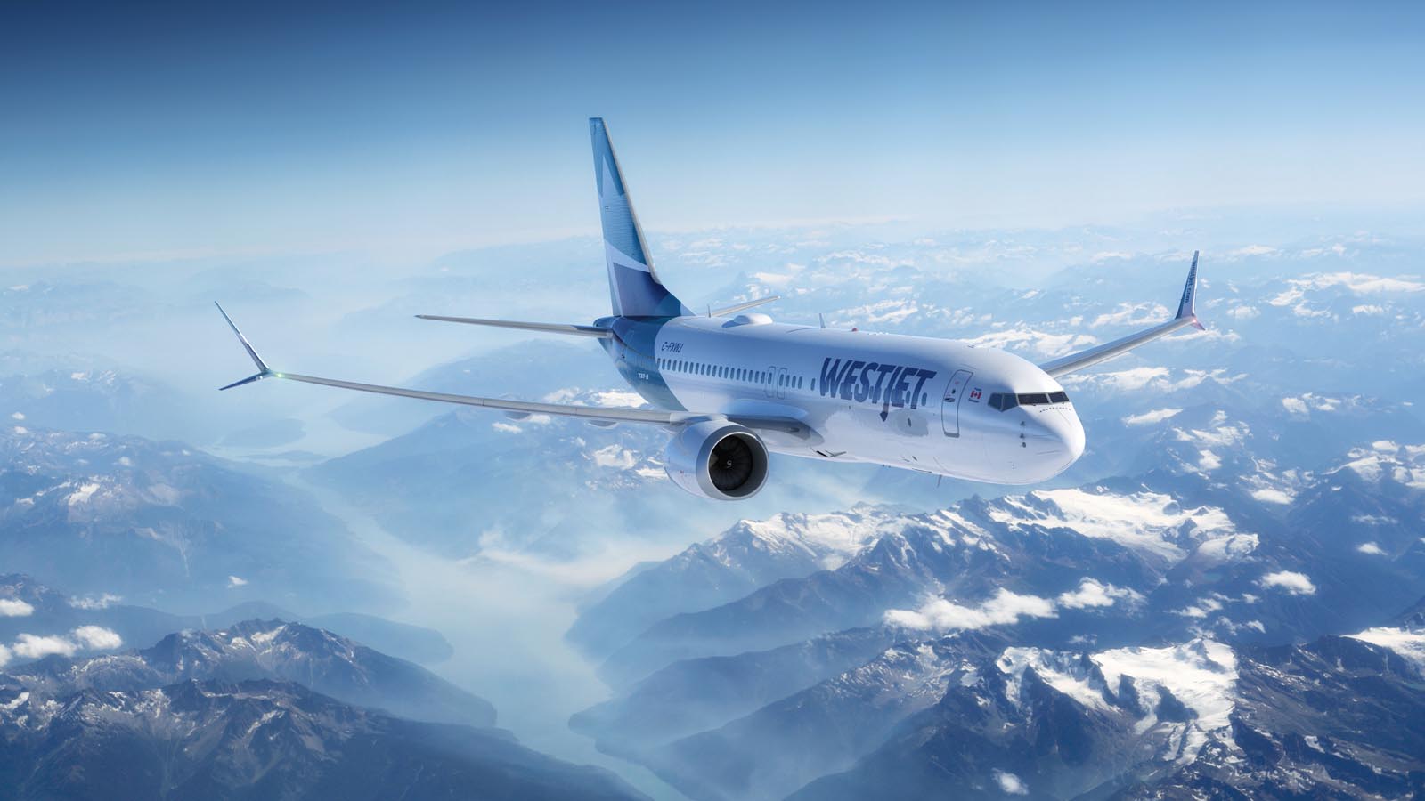 WestJet Boeing 737-8 MAX flying over Rocky Mountains