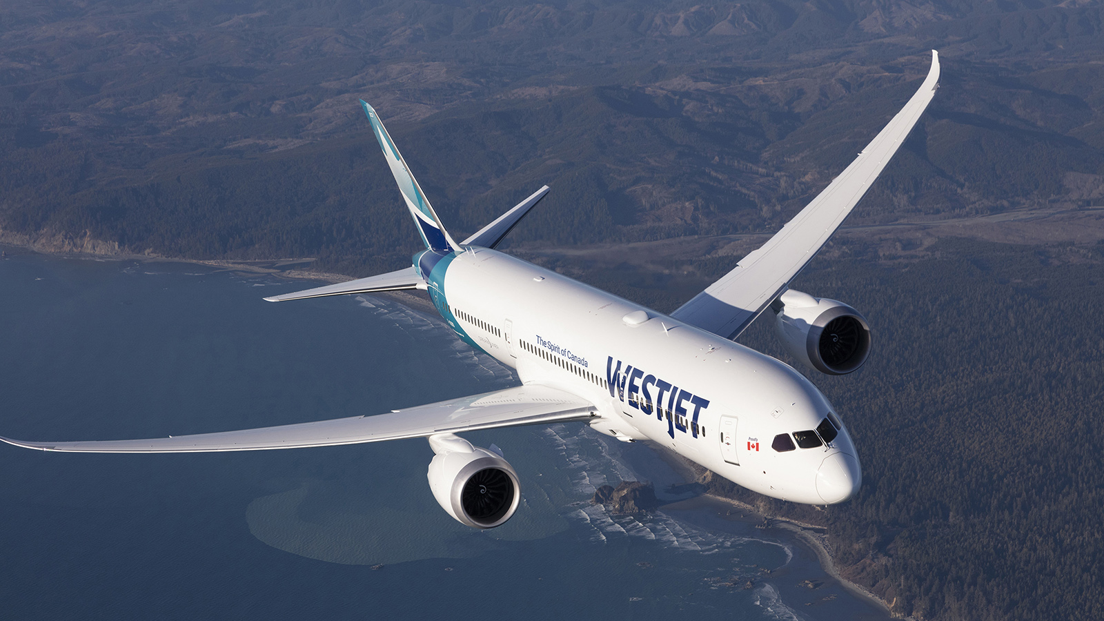 WestJet Boeing 787-9 Dreamliner flying over coast