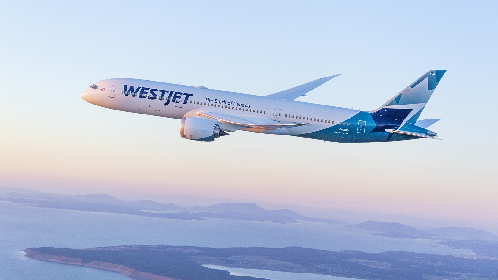 WestJet Boeing 787-9 Dreamliner flying over coast