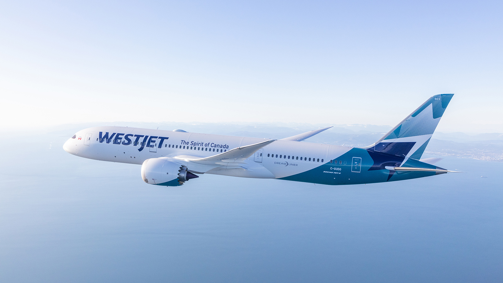 WestJet Boeing 787-9 Dreamliner flying over ocean