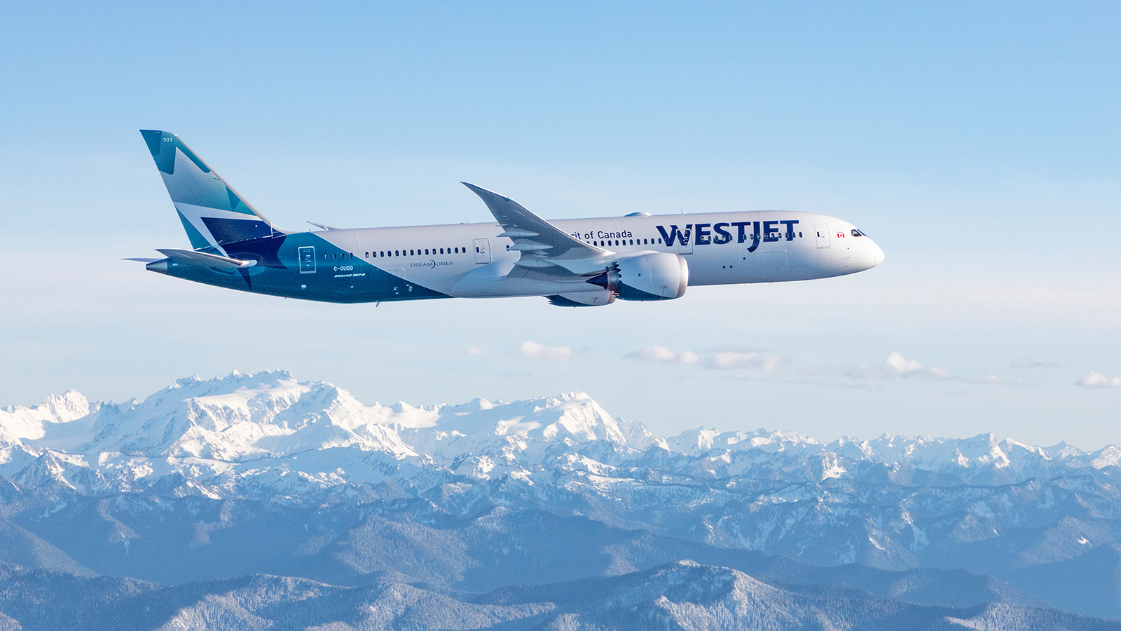 WestJet Boeing 787-9 Dreamliner flying over Rocky Mountains