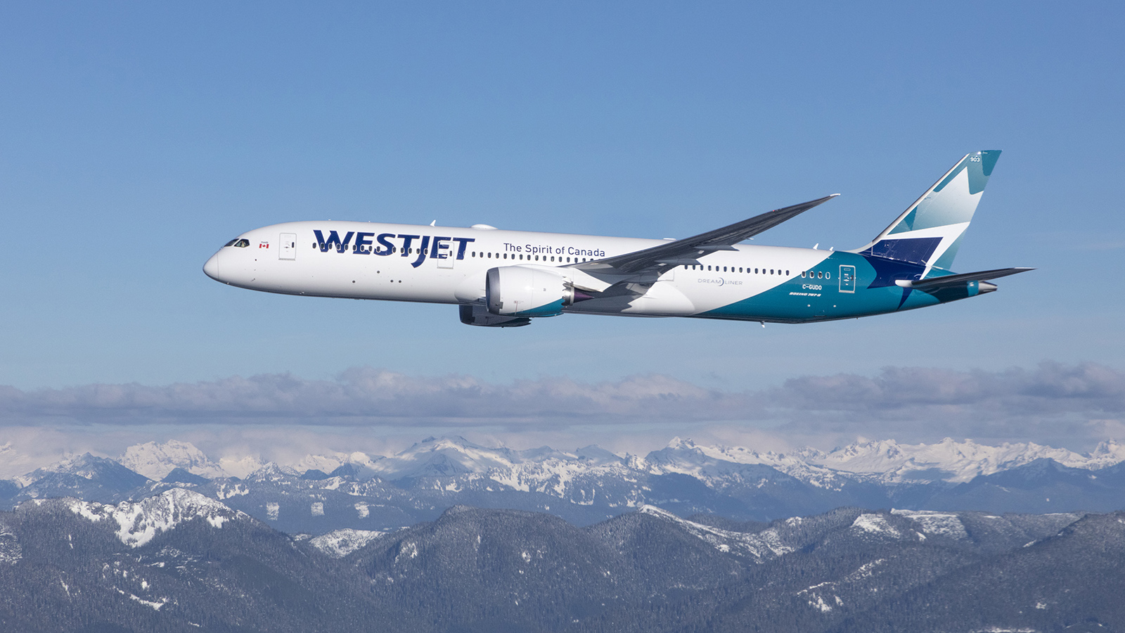 WestJet Boeing 787-9 Dreamliner flying over Rocky Mountains