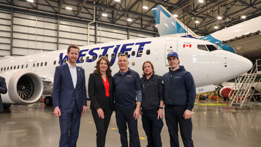 From left: Alexis von Hoensbroech, WestJet Group, CEO, The Honourable Danielle Smith, Alberta Premier tours WestJet's Calgary hangar