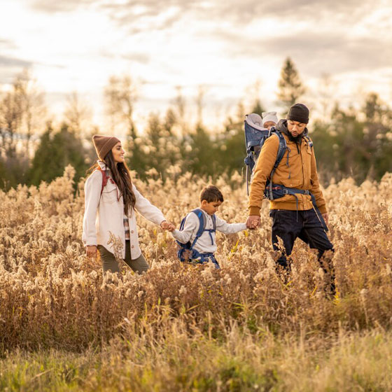 Young family hiking in fall