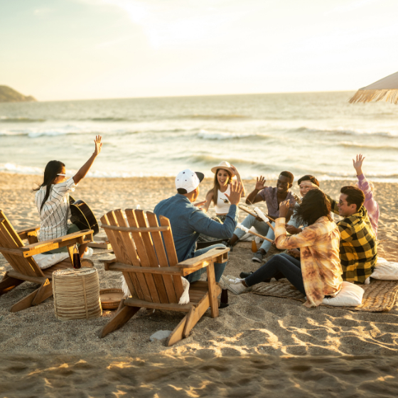 Friends having a picnic on a beach in Mexico