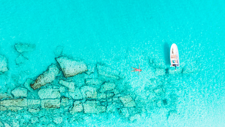 A person floating in the Caribbean sea