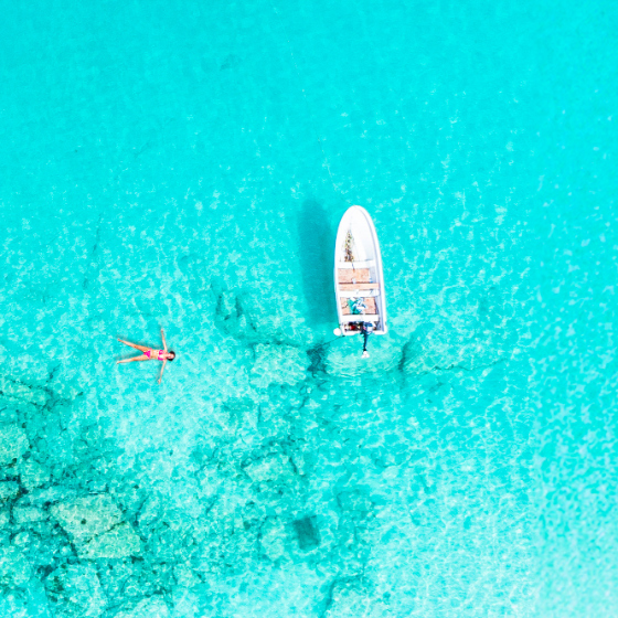 A person floating in the Caribbean sea