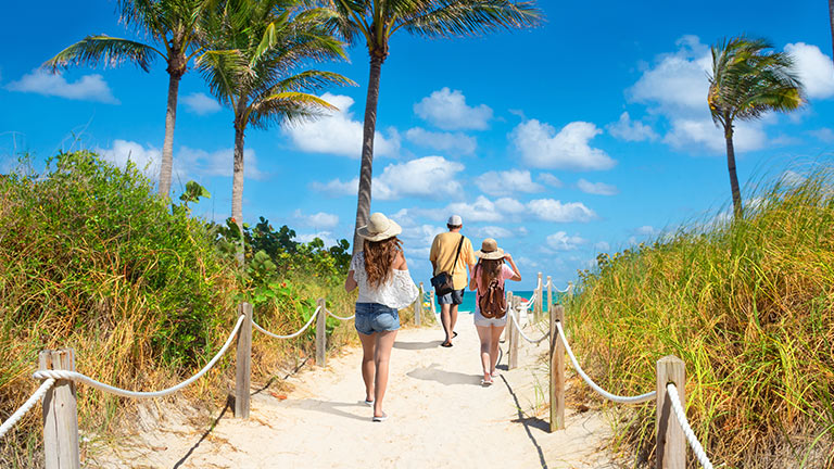 Family walking to beach