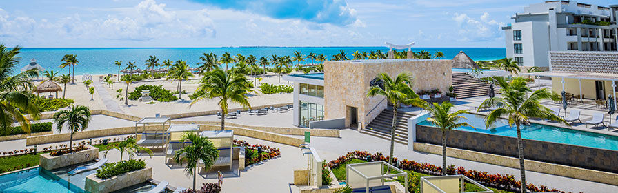View of pool and beach at Majestic Elegance Costa Mujeres