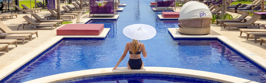 Person relaxing in pool at Planet Hollywood Cancun