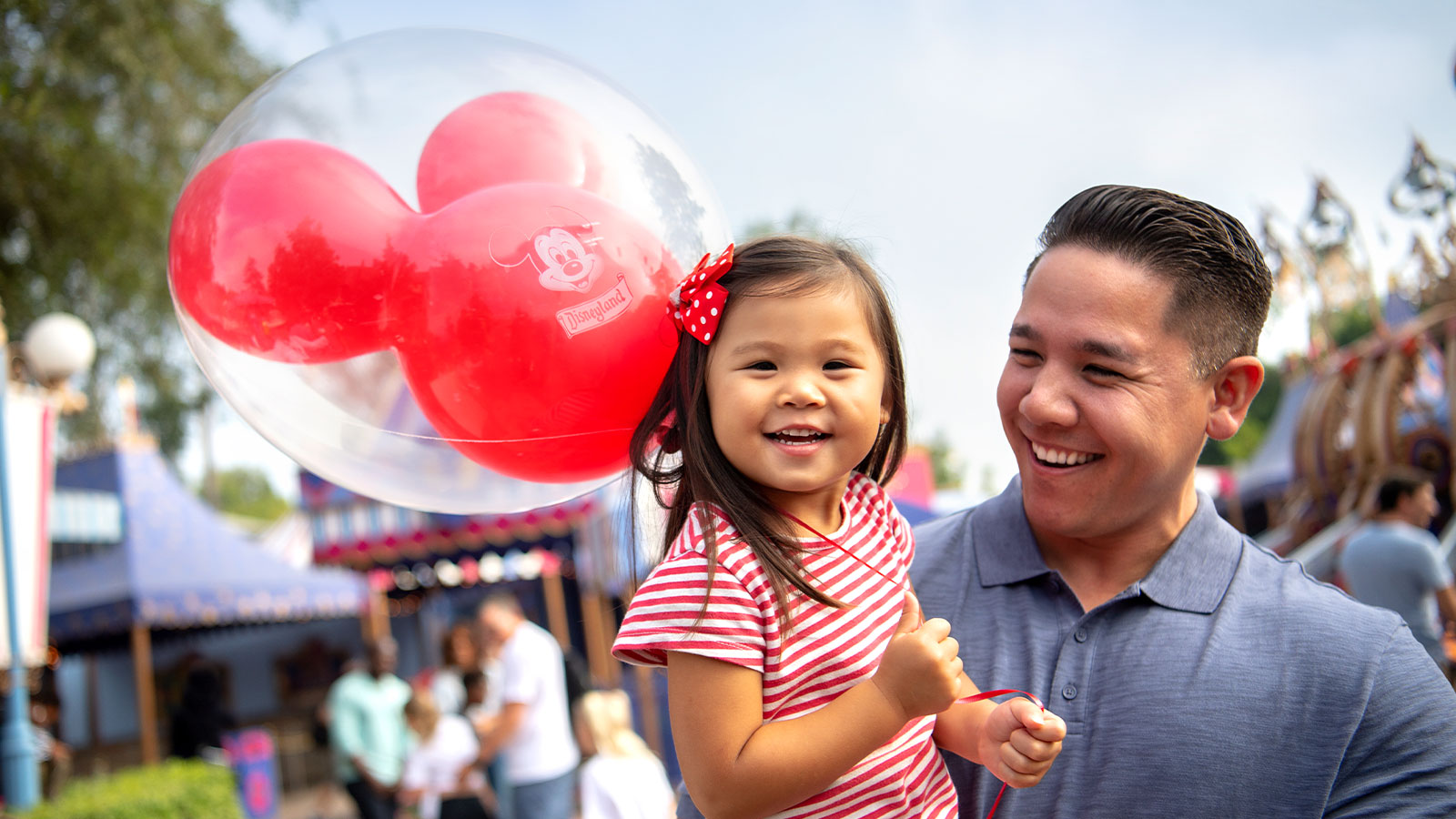 Parent and child enjoying their time at Disneyland Resort